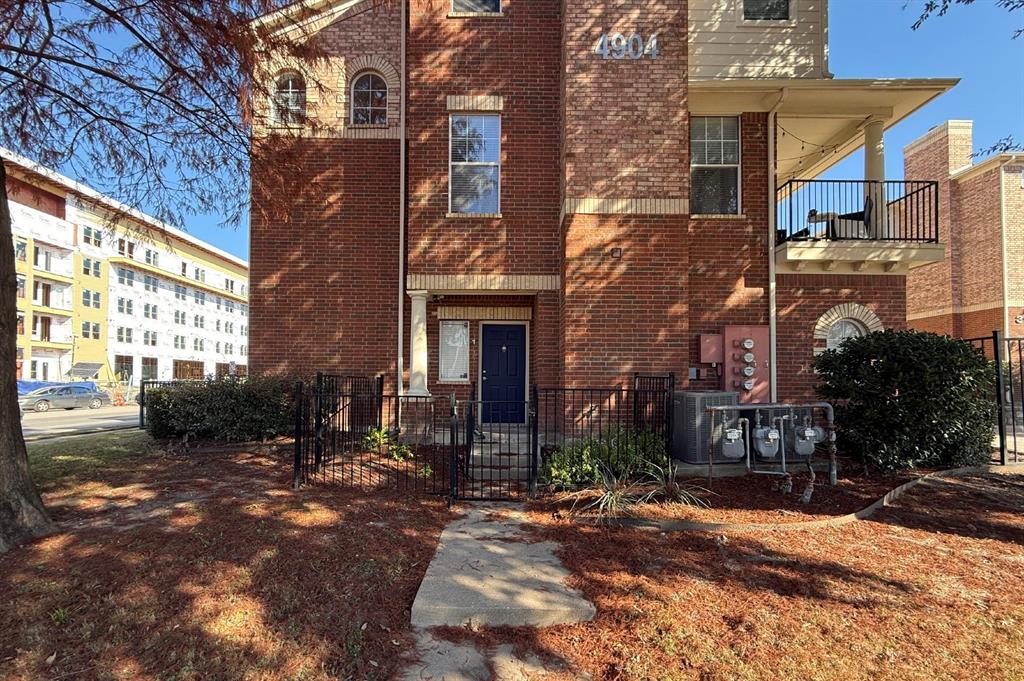 4904 Live Oak Street, Unit 1 Dallas, TX 75206 - Photo 1 of 20 a view of a brick building with many windows