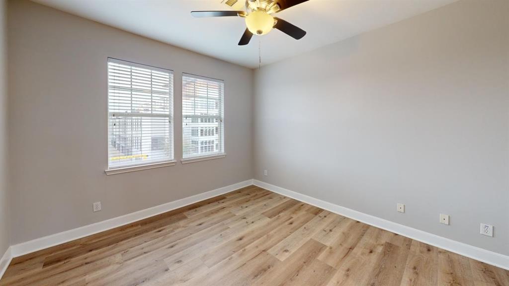 4904 Live Oak Street, Unit 1 Dallas, TX 75206 - Photo 11 of 20 wooden floor in an empty room with a window