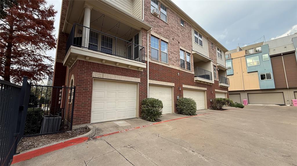 4904 Live Oak Street, Unit 1 Dallas, TX 75206 - Photo 17 of 20 a view of a street with brick building