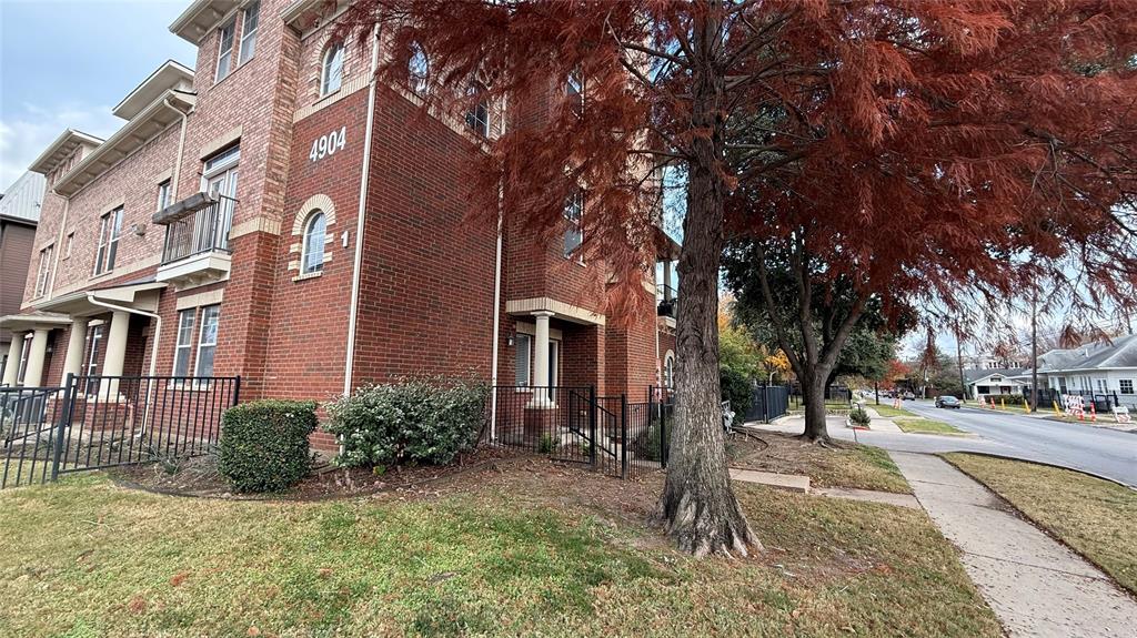 4904 Live Oak Street, Unit 1 Dallas, TX 75206 - Photo 18 of 20 a view of a building with a yard