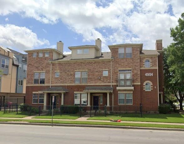 4904 Live Oak Street, Unit 1 Dallas, TX 75206 - Photo 19 of 20 a front view of a building with garage and yard