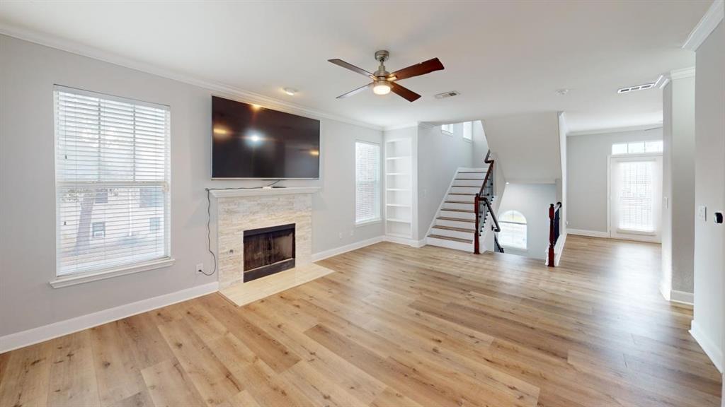4904 Live Oak Street, Unit 1 Dallas, TX 75206 - Photo 3 of 20 a living room with fireplace furniture and a flat screen tv