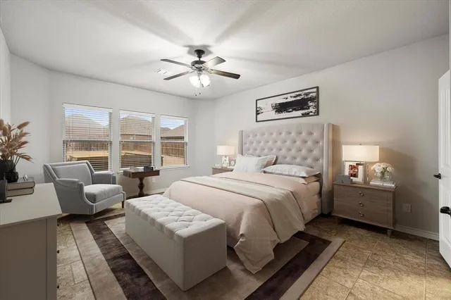 a bedroom with bed and a chandelier