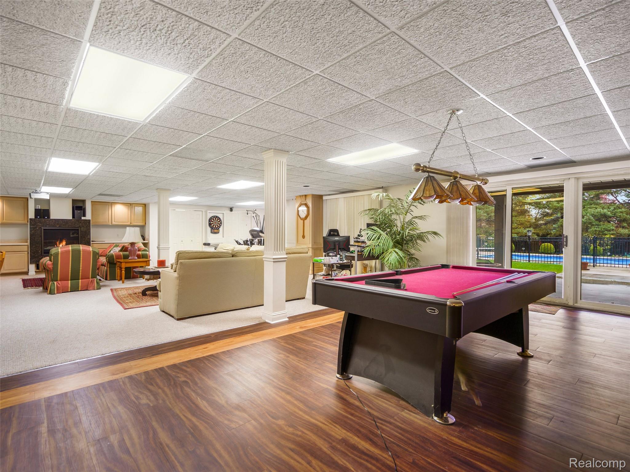 5724 Murfield Drive Rochester, MI 48306 - Photo 93 of 99 Game room featuring billiards table, wood finished floors, and a paneled ceiling
