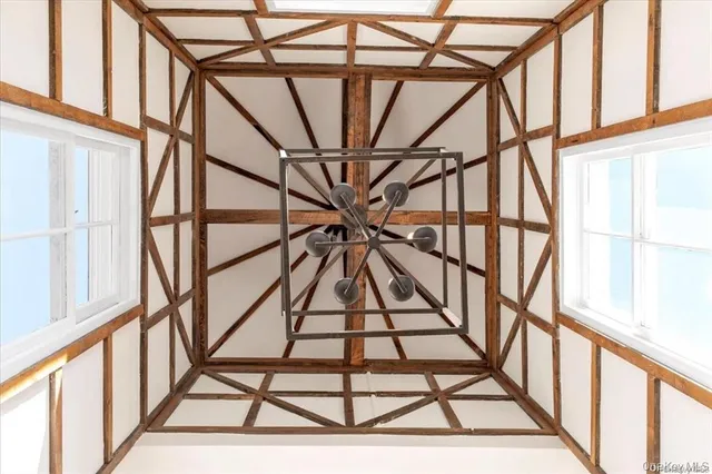 a view of a kitchen with a sink and a refrigerator