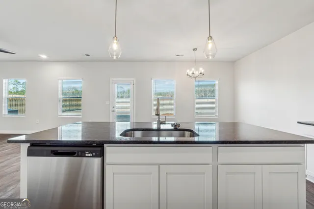 a kitchen with a counter space and window