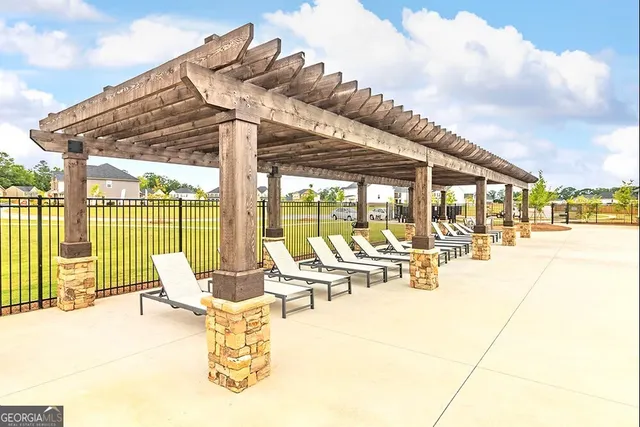 a building outdoor space with patio lots of furniture