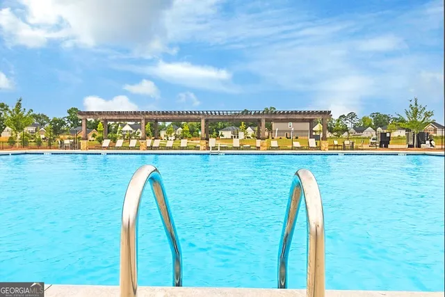 a view of a swimming pool with an ocean view
