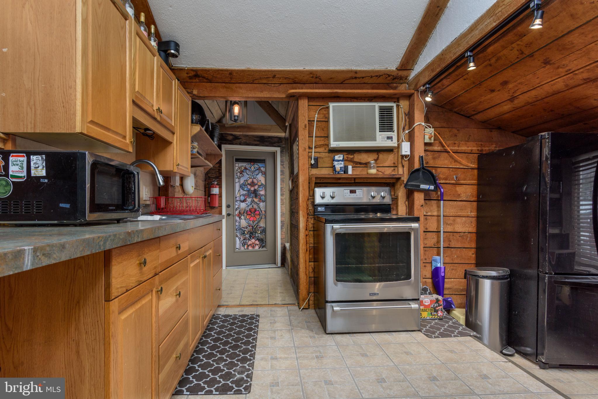 1016 Blue Ridge Road Harrisburg, PA 17110 - Photo 14 of 30 a kitchen with stainless steel appliances a stove and a refrigerator