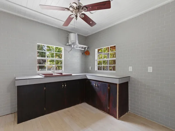 a kitchen with a cabinets and window
