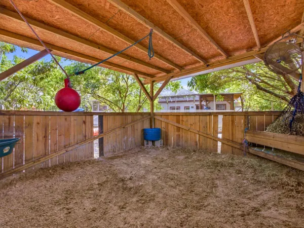 a view of a backyard with sitting area