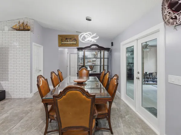 a dining room with furniture and window