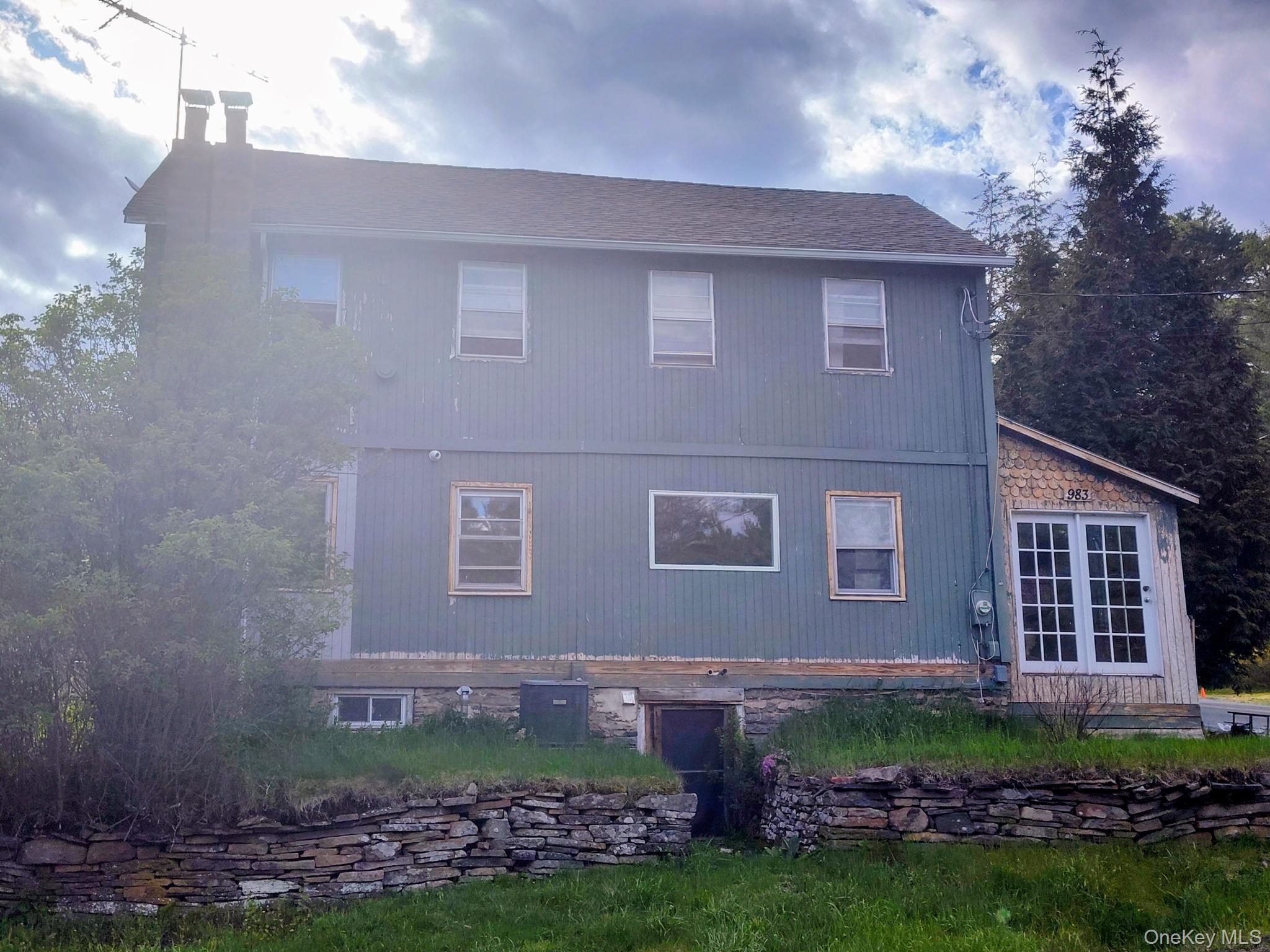 WELCOME HOME!!! Two-story 1800's farmhouse featuring vertical siding and a shingle roof
