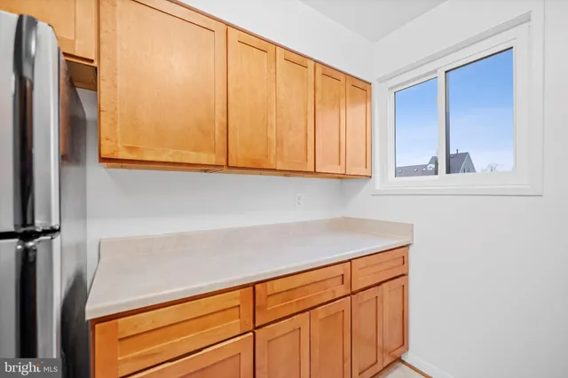 a view of cabinets and wooden floor