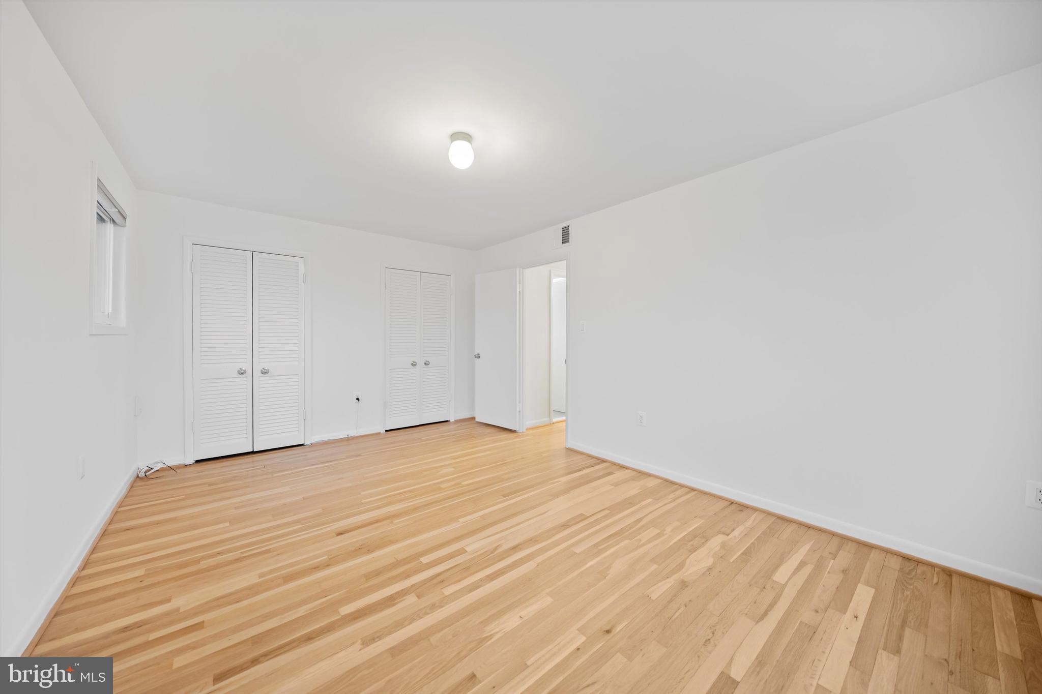 11508 Bucknell Drive, Unit 203 Silver Spring, MD 20902 - Photo 20 of 21 a view of empty room with wooden floor