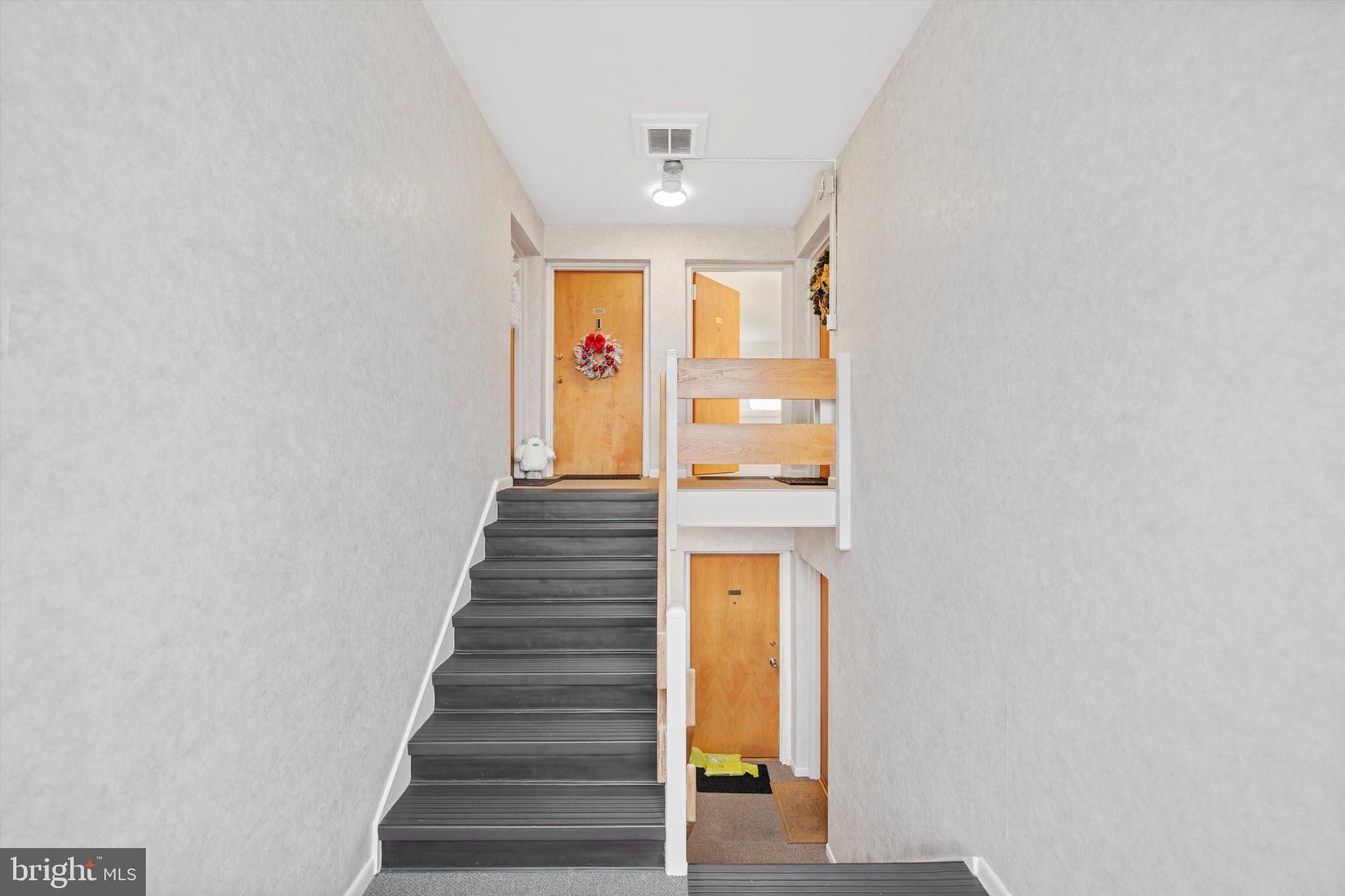 11508 Bucknell Drive, Unit 203 Silver Spring, MD 20902 - Photo 3 of 21 a view of entryway and hall with wooden floor