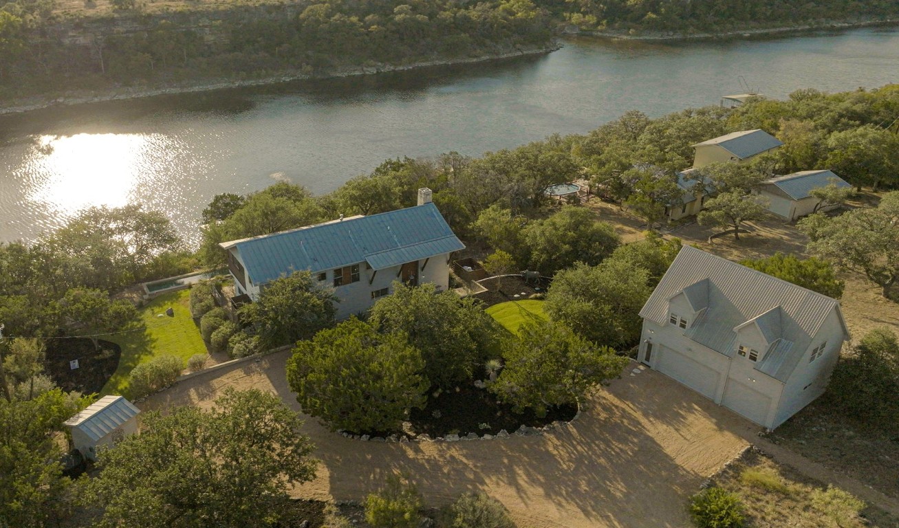 an aerial view of a house with a yard and a garden