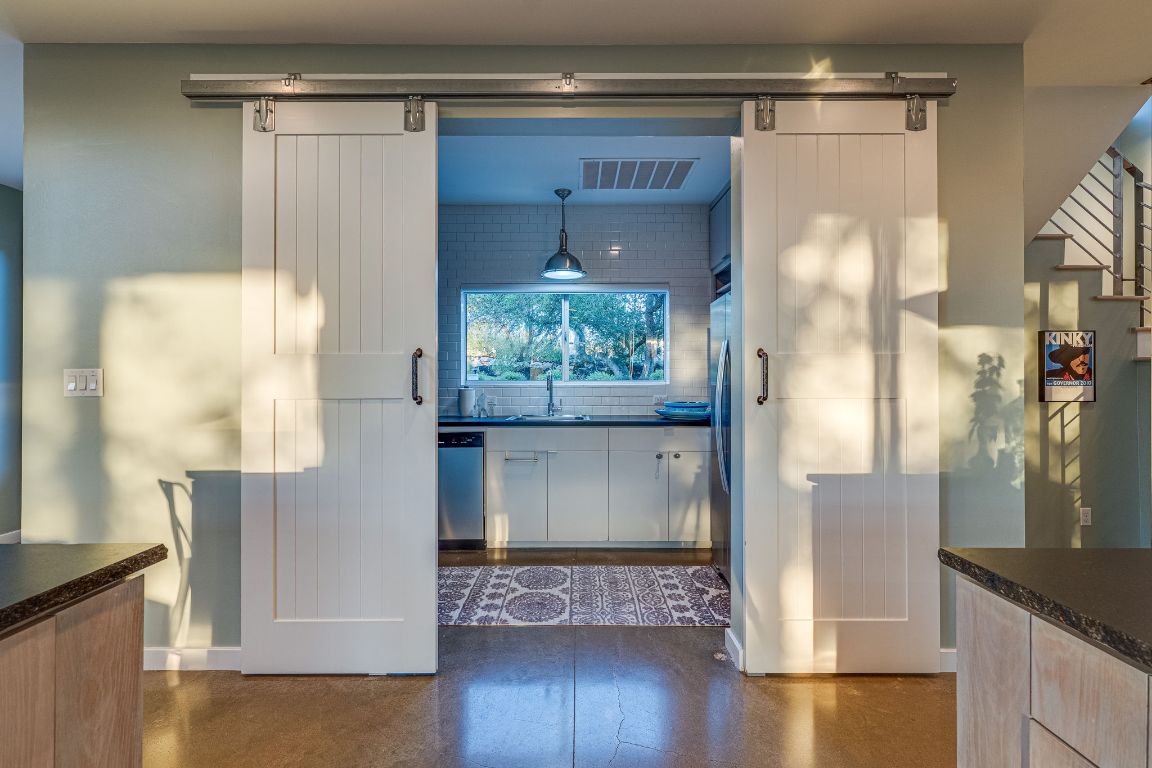 23601 Old Ferry Road, Unit 20 Spicewood, TX 78669 - Photo 20 of 40 a view of kitchen with furniture and wooden floor
