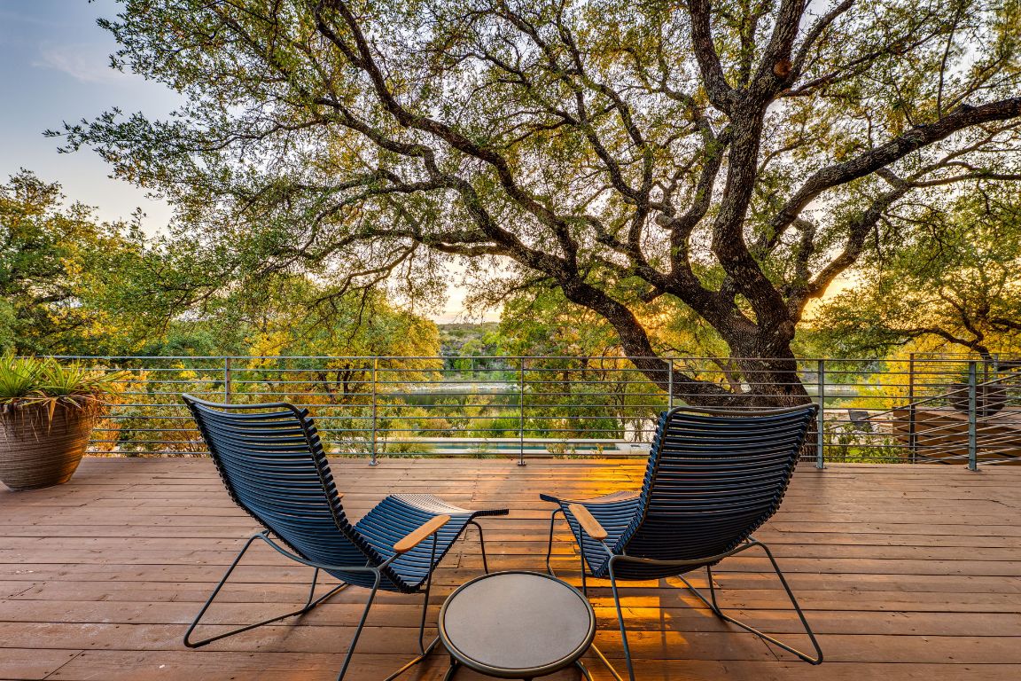 23601 Old Ferry Road, Unit 20 Spicewood, TX 78669 - Photo 35 of 40 a view of a chairs and table on the wooden floor