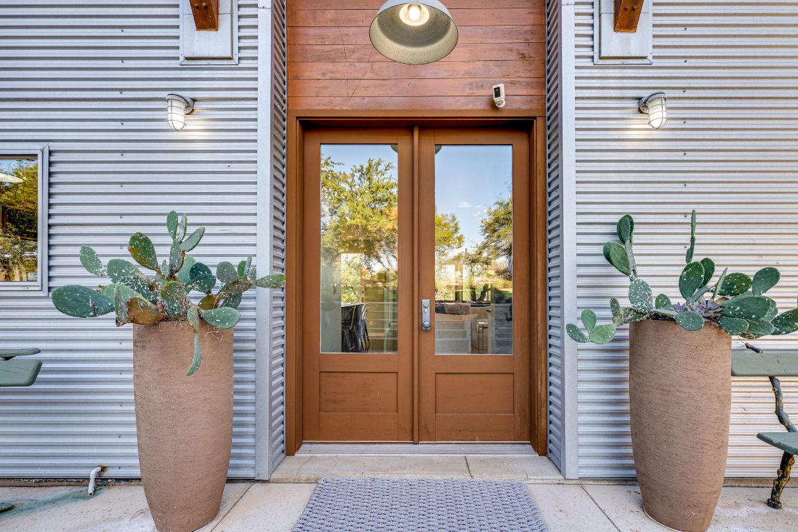 23601 Old Ferry Road, Unit 20 Spicewood, TX 78669 - Photo 9 of 40 a view of entryway with a potted plant