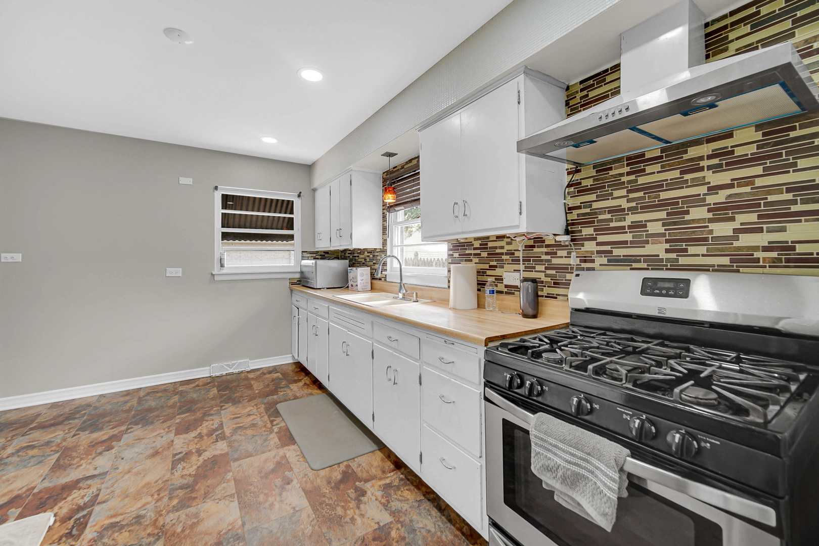 1107 Campbell Avenue Wheaton, IL 60189 - Photo 11 of 20 a kitchen with a stove and a sink