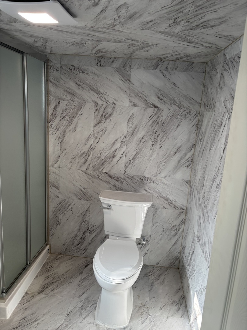 1107 Campbell Avenue Wheaton, IL 60189 - Photo 19 of 20 a white toilet sitting next to a shower
