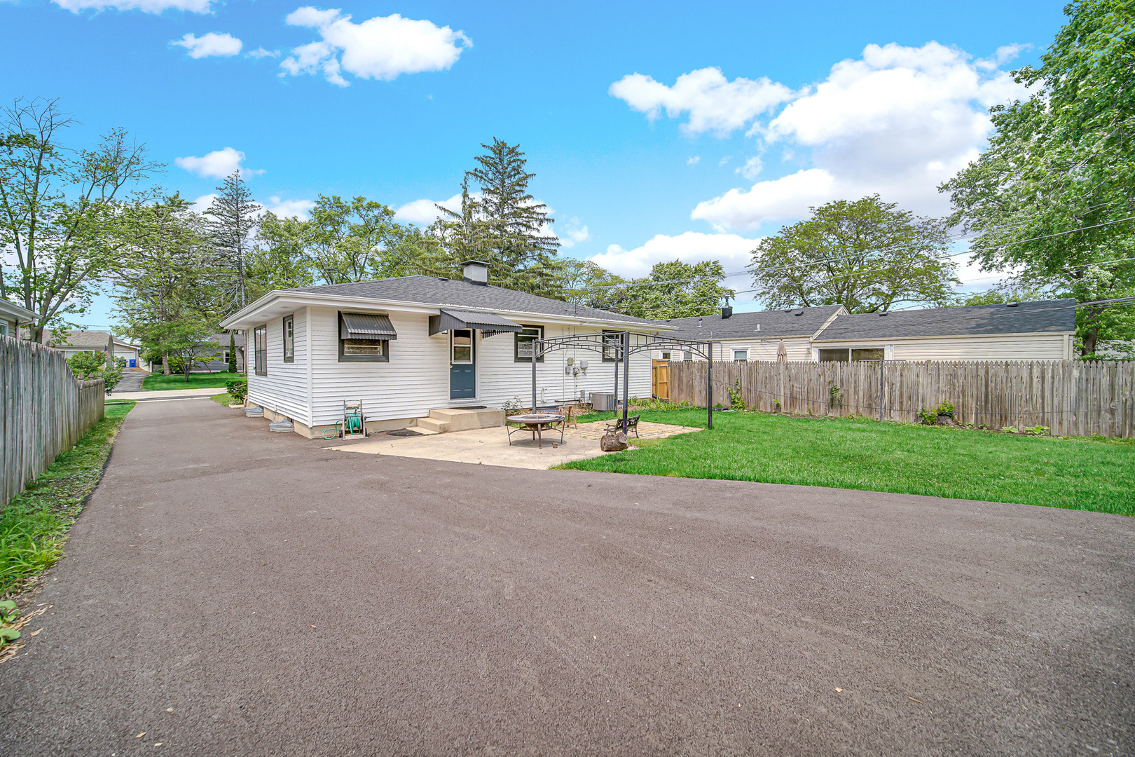 1107 Campbell Avenue Wheaton, IL 60189 - Photo 3 of 20 a front view of a house with a yard and a garden