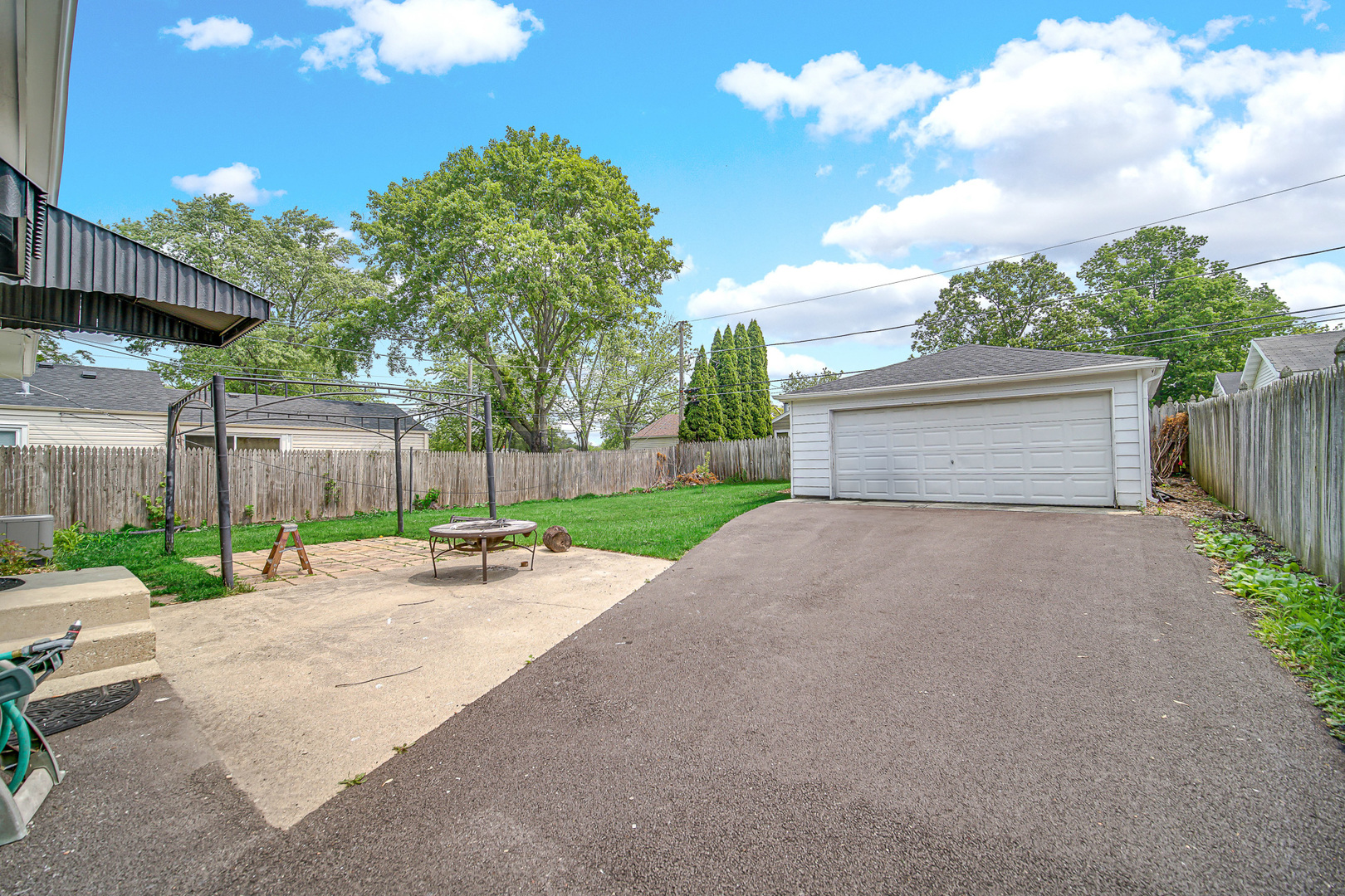 1107 Campbell Avenue Wheaton, IL 60189 - Photo 4 of 20 a view of a house with a yard and garage