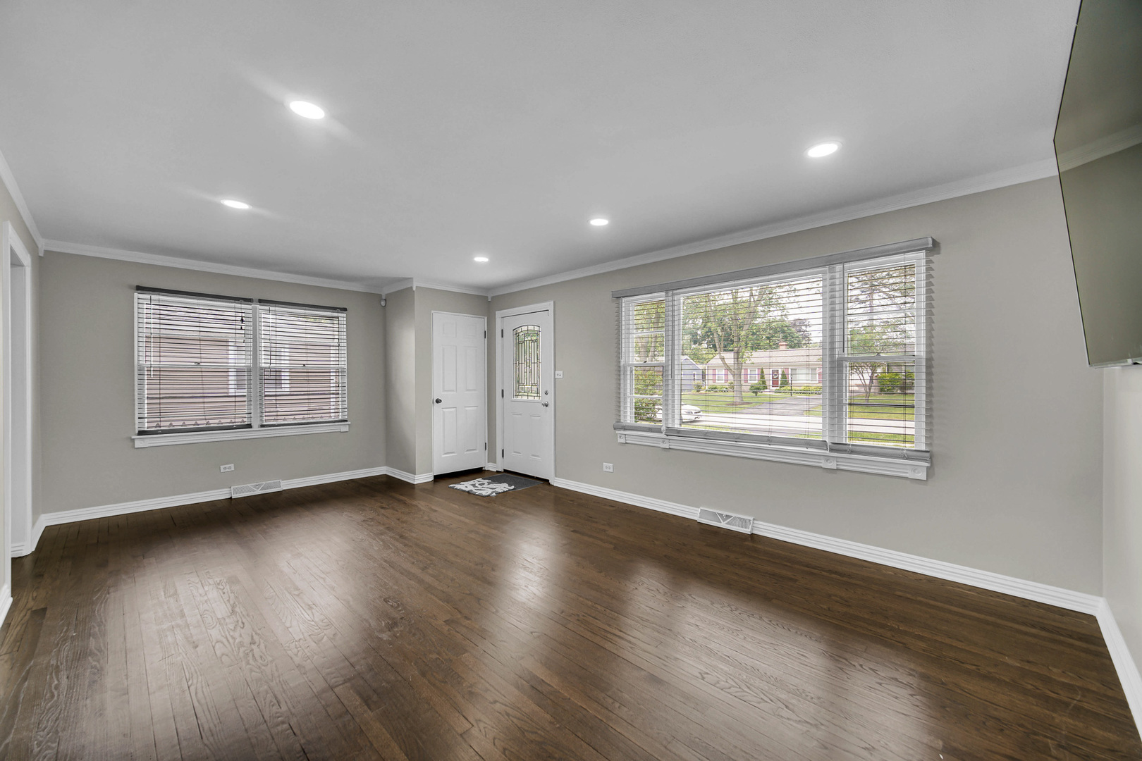 1107 Campbell Avenue Wheaton, IL 60189 - Photo 6 of 20 an empty room with wooden floor and windows