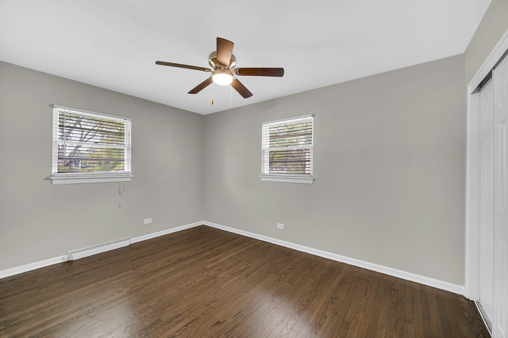 1107 Campbell Avenue Wheaton, IL 60189 - Photo 10 of 20 a view of a big room with wooden floor and windows
