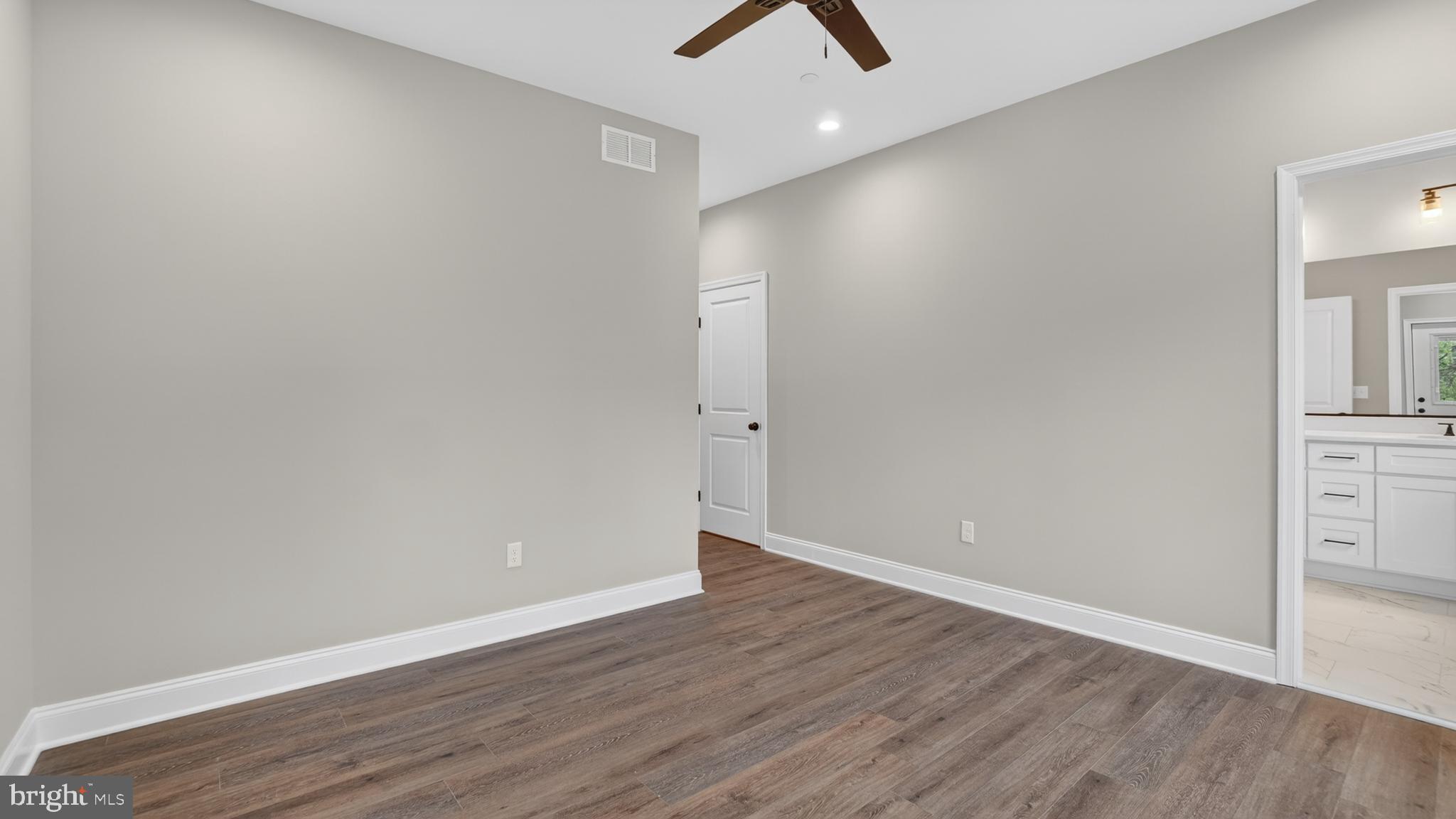 2001 Poplar Ridge Road Pasadena, MD 21122 - Photo 25 of 83 an empty room with wooden floor and ceiling fan
