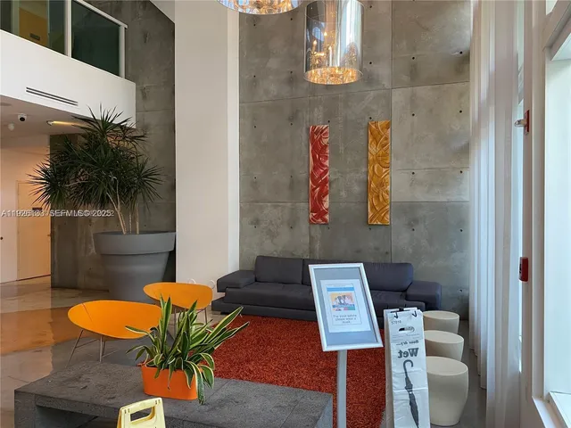 a balcony with table and chairs