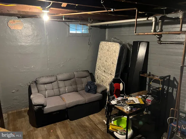 a living room with furniture and a mirror