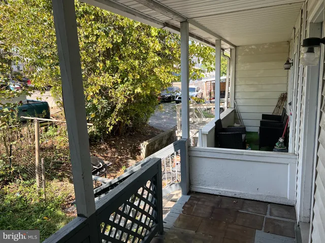 a view of a balcony with furniture