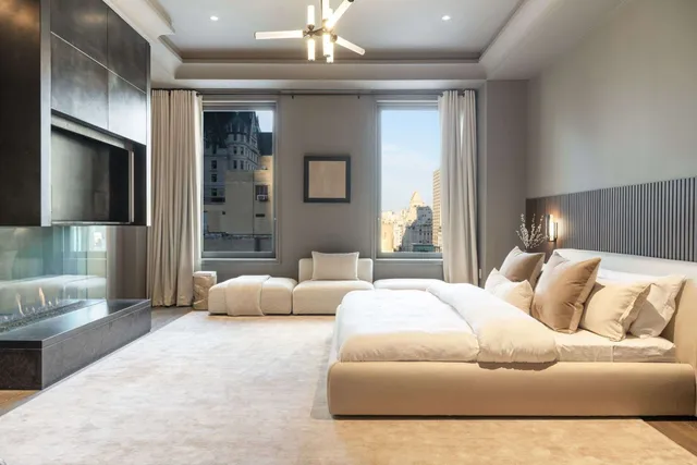 a bedroom with a bed couch and window