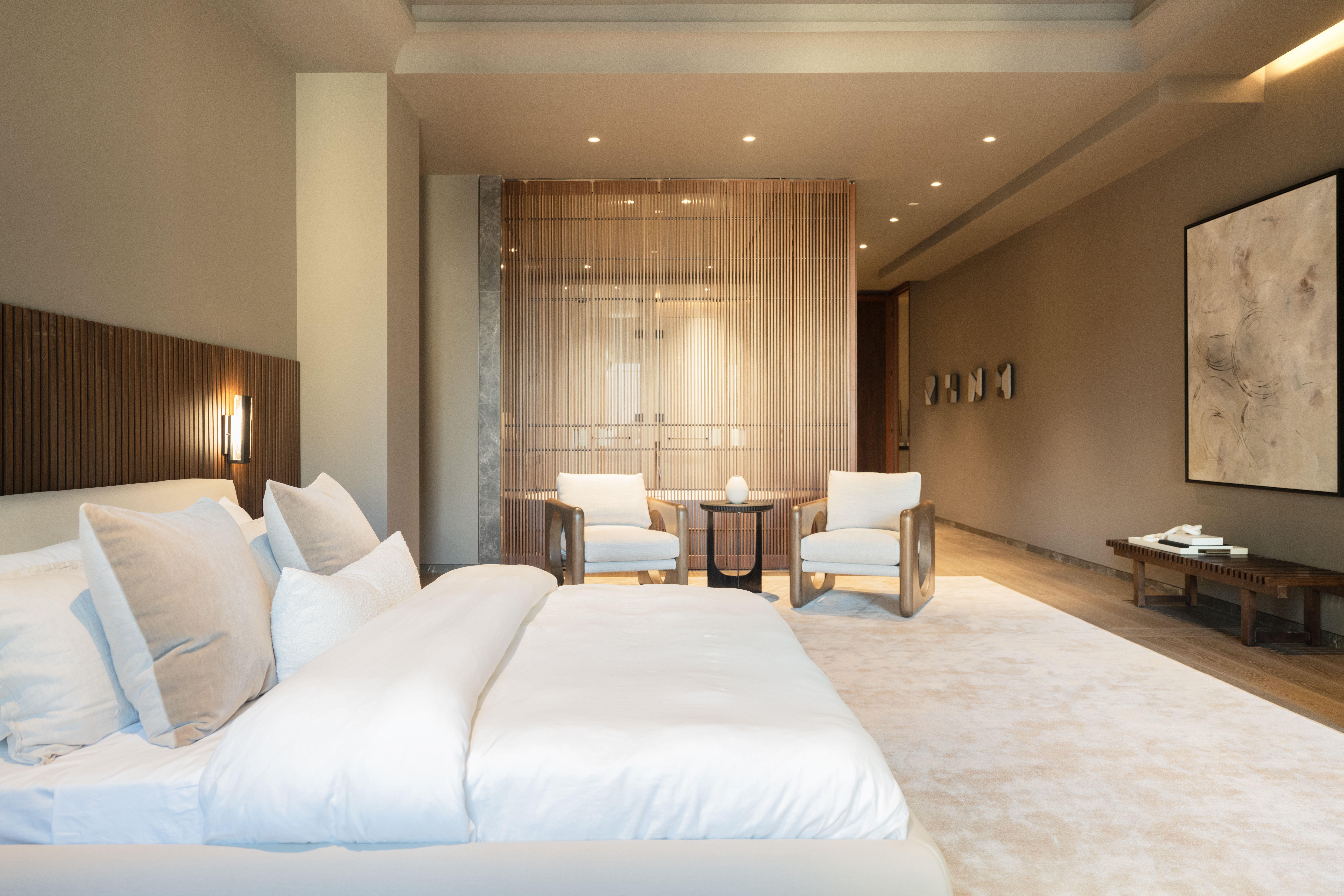 730 5th Avenue, Unit 16B Manhattan, NY 10019 - Photo 3 of 7 a large bedroom with a bed and glass windows