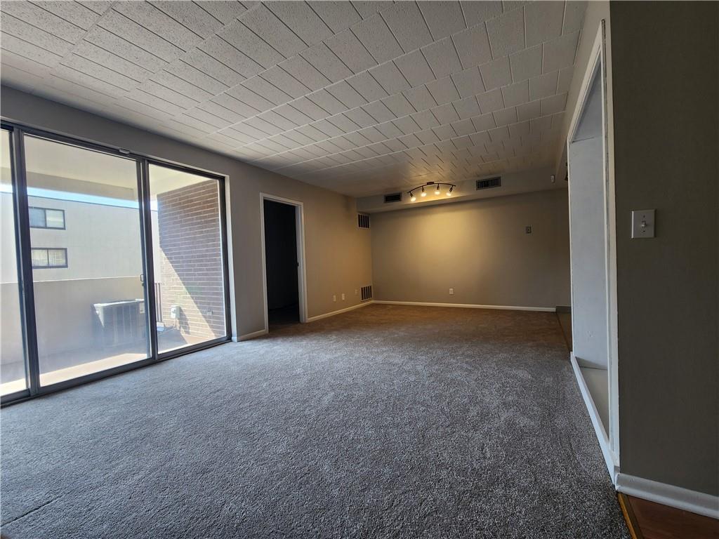 301 South Home Avenue, Unit 411 Pittsburgh, PA 15202 - Photo 11 of 20 an empty room with a empty space and windows