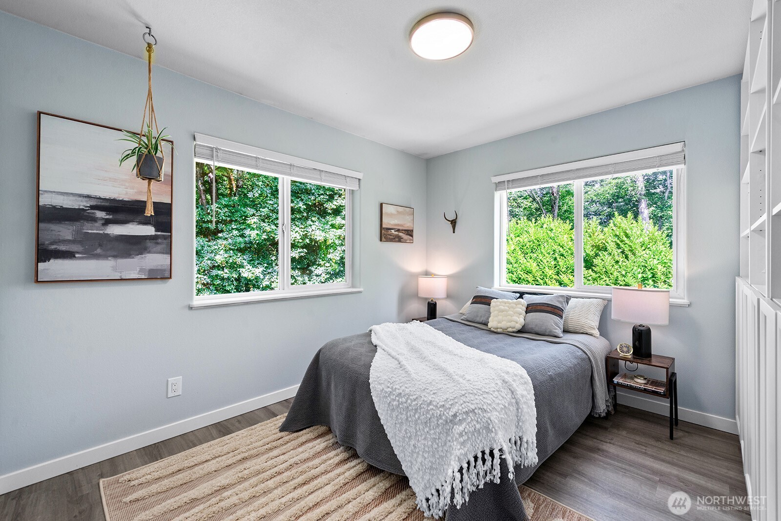 23835 Dockton Road Southwest Vashon, WA 98070 - Photo 17 of 38 a bedroom with a bed and a window