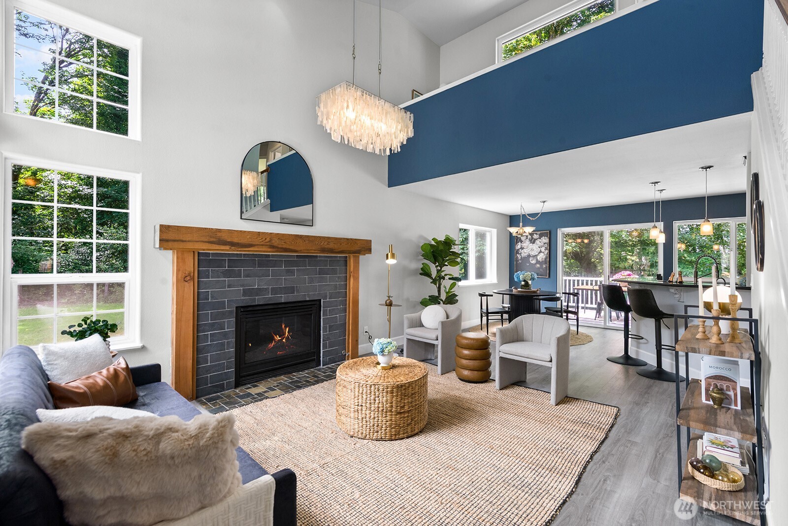 23835 Dockton Road Southwest Vashon, WA 98070 - Photo 2 of 38 a living room with furniture potted plant and a fireplace
