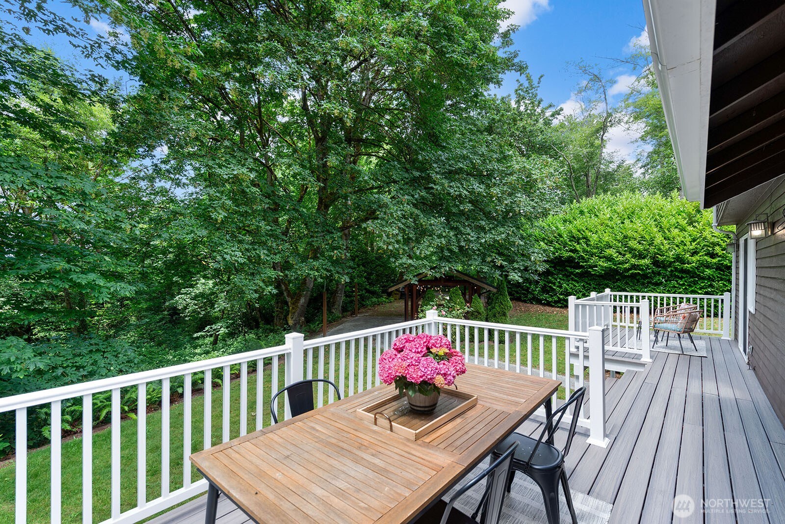 23835 Dockton Road Southwest Vashon, WA 98070 - Photo 21 of 38 a deck with hardwood table and chairs