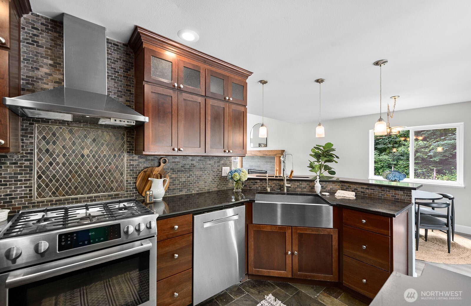 23835 Dockton Road Southwest Vashon, WA 98070 - Photo 3 of 38 a kitchen with a sink and appliances