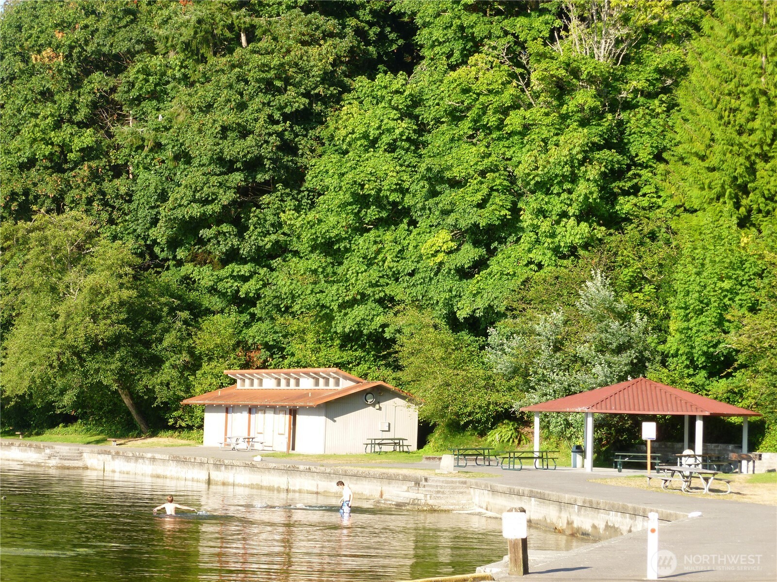 23835 Dockton Road Southwest Vashon, WA 98070 - Photo 34 of 38 a swimming pool with outdoor seating and yard
