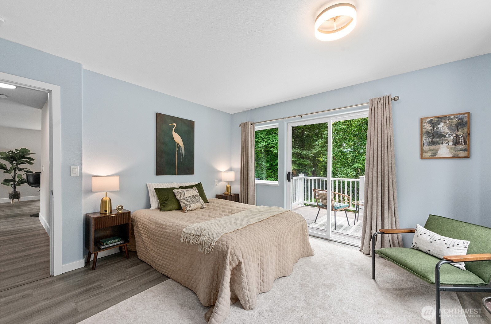 23835 Dockton Road Southwest Vashon, WA 98070 - Photo 9 of 38 a bedroom with a bed and large windows