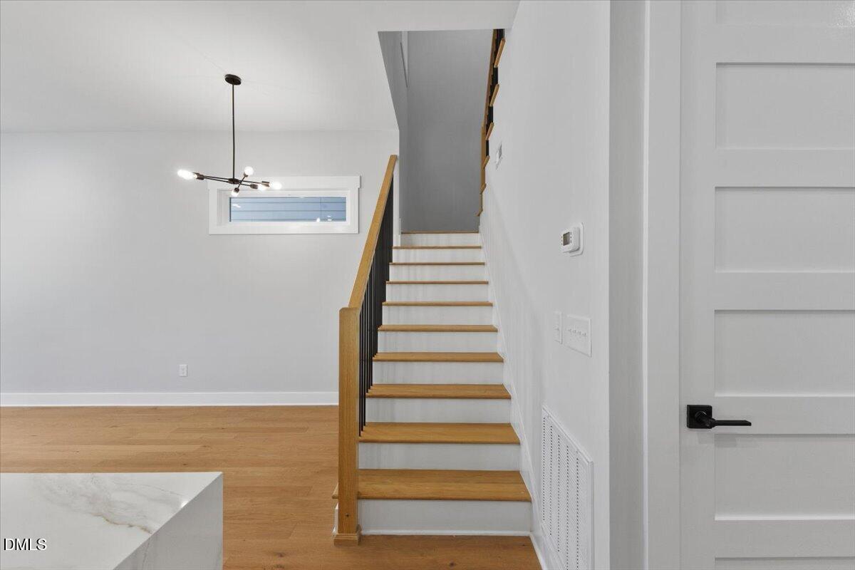 541 Bragg Street Raleigh, NC 27601 - Photo 14 of 44 a view of a room with wooden floor and entryway
