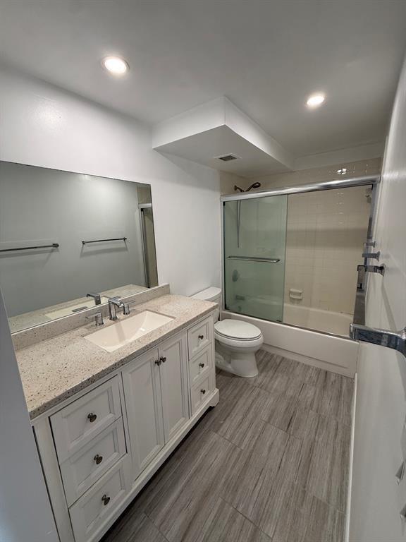 9 Royal Palm Way Boca Raton, FL 33432 - Photo 5 of 10 a bathroom with a double vanity sink toilet and shower