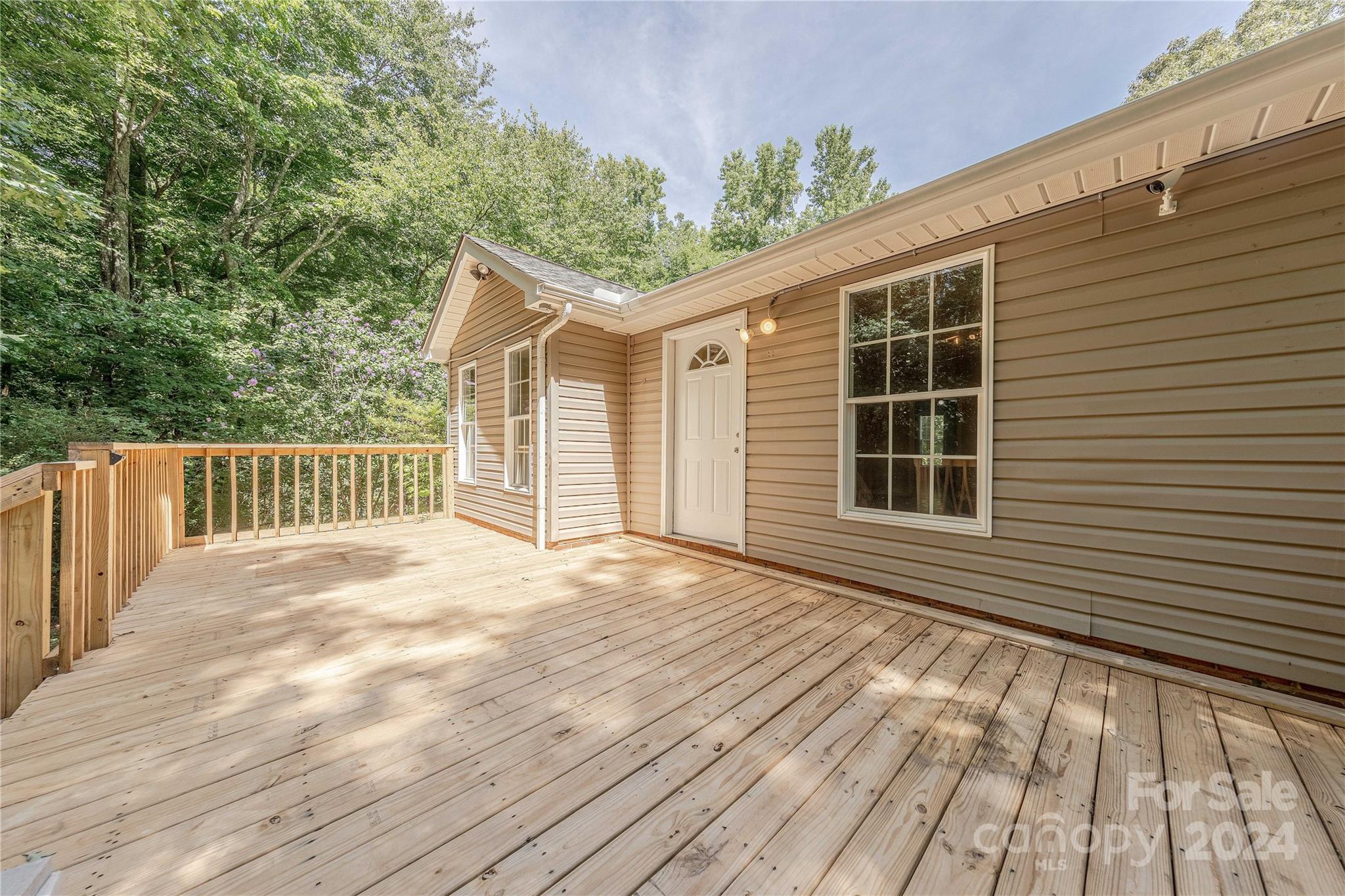 3230 McLendon Road Matthews, NC 28104 - Photo 25 of 29 a view of a house with a backyard
