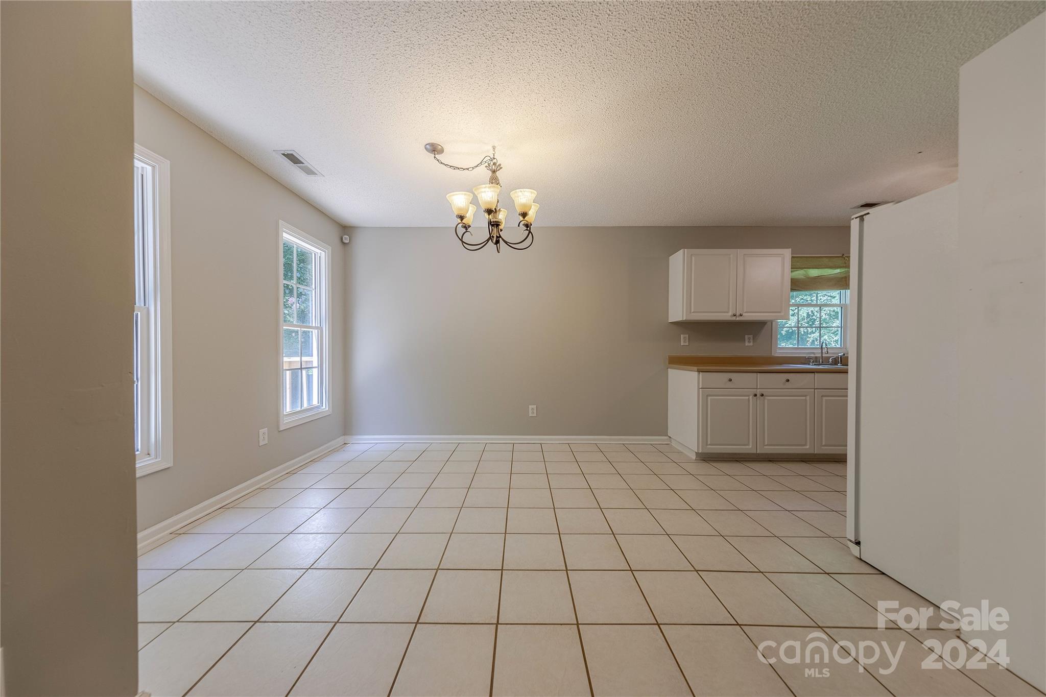 3230 McLendon Road Matthews, NC 28104 - Photo 8 of 29 a view of a kitchen with microwave and cabinets