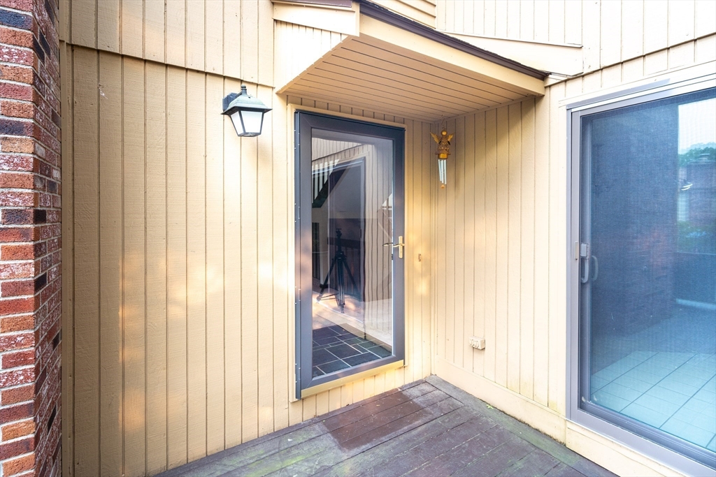 110 Mountain Gate Road, Unit 110 Ashland, MA 01721 - Photo 6 of 42 a view of a front door and wooden door