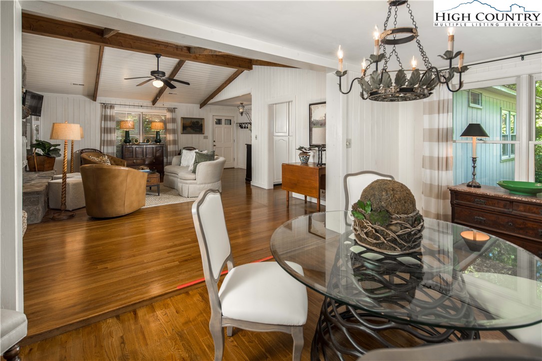 271 Pinnacle Avenue Blowing Rock, NC 28605 - Photo 12 of 43 a dining room with furniture a chandelier and wooden floor