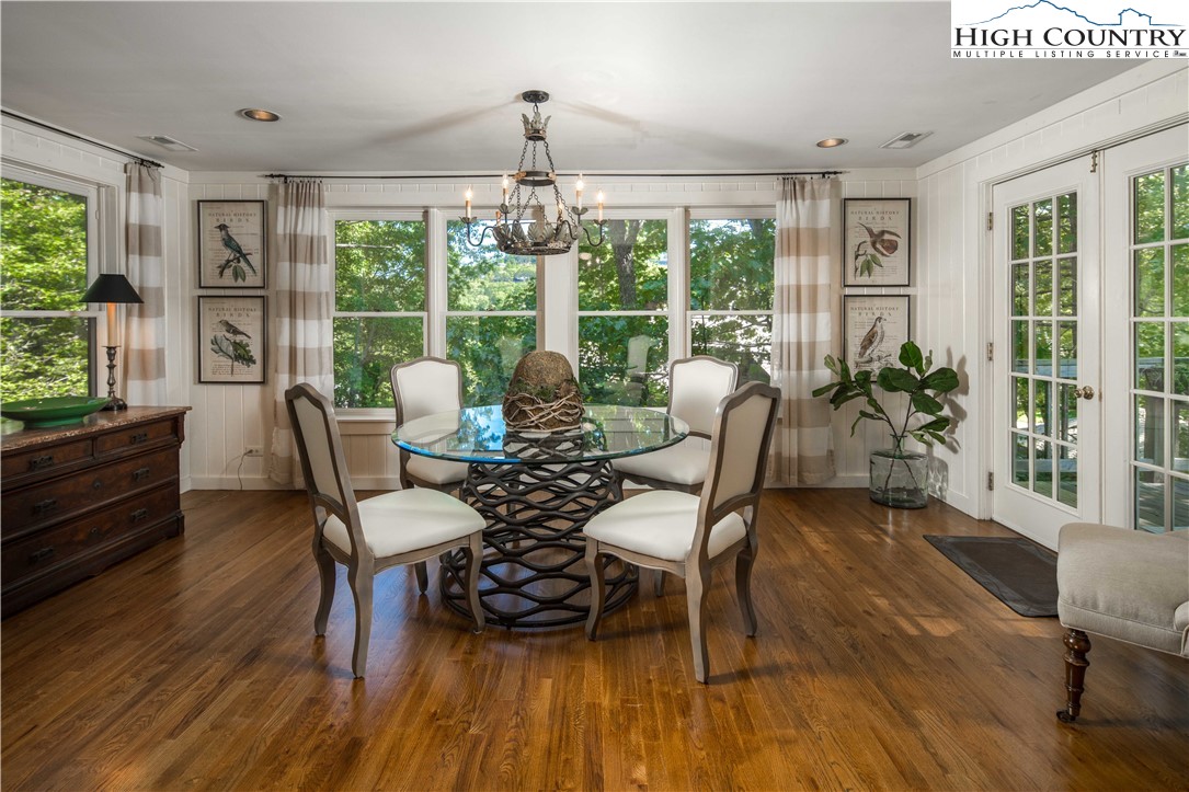 271 Pinnacle Avenue Blowing Rock, NC 28605 - Photo 13 of 43 a dining room with furniture window and wooden floor